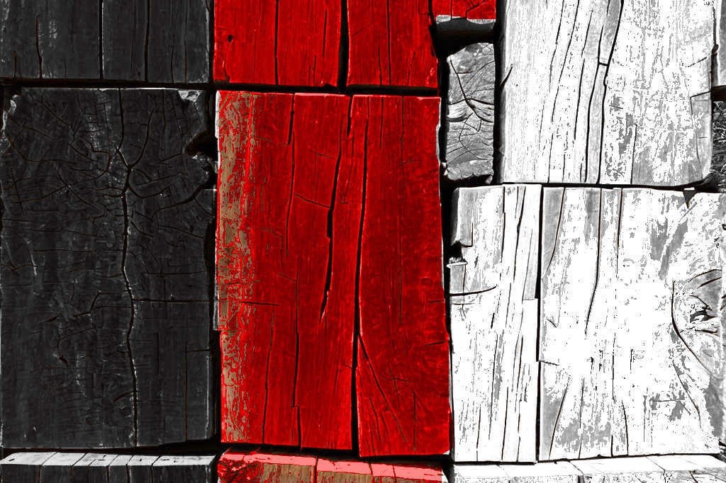 Racism drives a wedge depicted by a wedge between wooden blocks